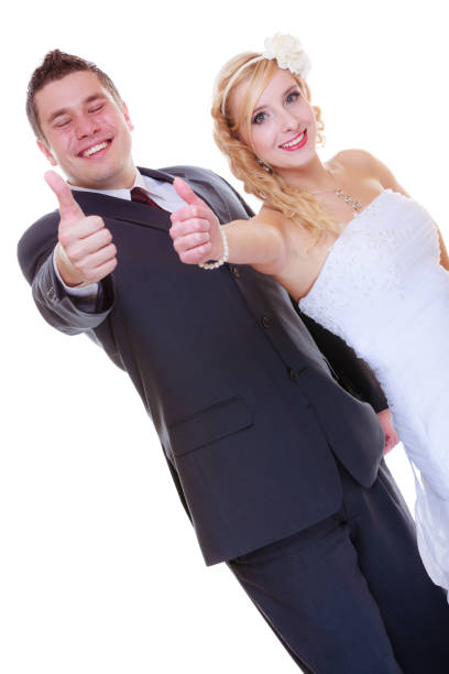 istock Happy groom and bride posing for marriage photo 1147178633