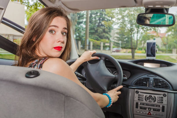 istock Stressed woman driving car 1147178674