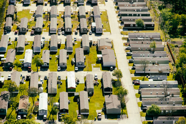 Trailer Park Neighborhood Aerial A well maintained mobile home park shot from above in east Texas near Galvaston and Texas City just south of Houston. manufactured housing stock pictures, royalty-free photos & images