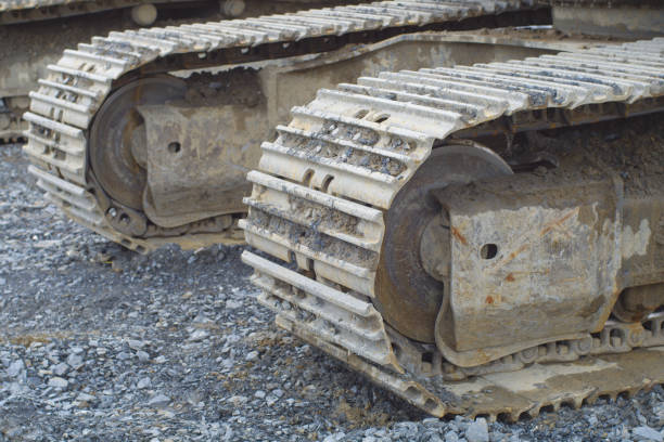 istock excavator bulldoser caterpillar closeup track construction site digger industry 1147179885