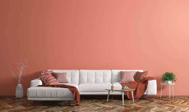 Interior of modern living room with white fabric sofa over coral wall 3d rendering