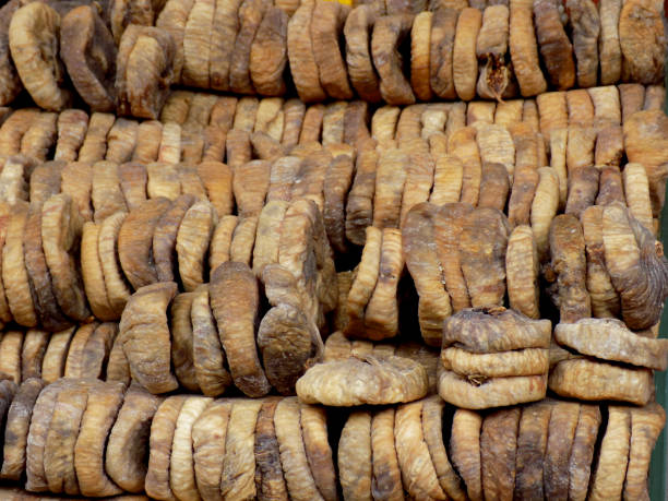 istock Dried figs on the market stand as a background 1147182107