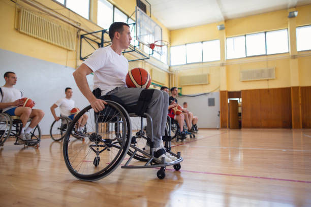 istock Determined paralyzed basketball team practicing their skills before a game 1147182459