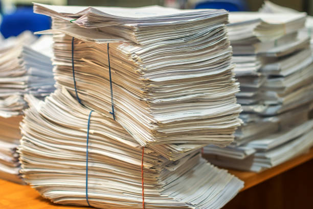 istock pile of paper documents in the office 1147185806
