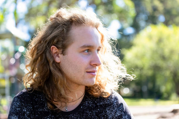 istock Portrait of dreaming young man, background with copy space 1147188289