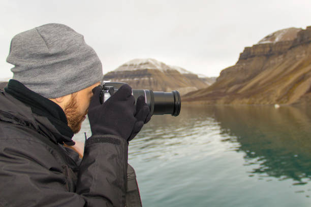 istock Tourist taking photos with DSLR camera 1147191109
