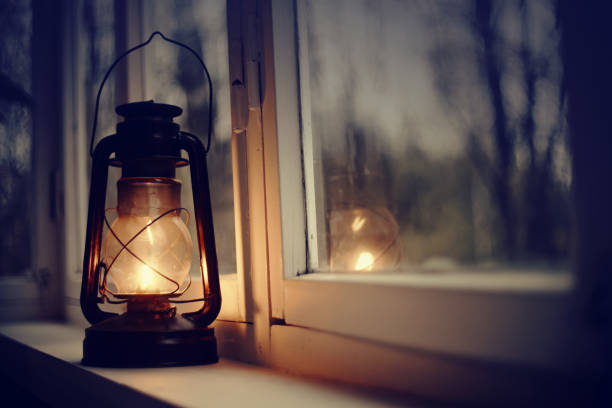 istock An old kerosene lamp stands on a white windowsill 1147191231