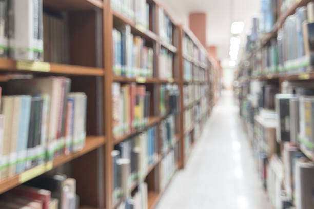 istock Blur school library or study room with book shelves for education background 1147194048
