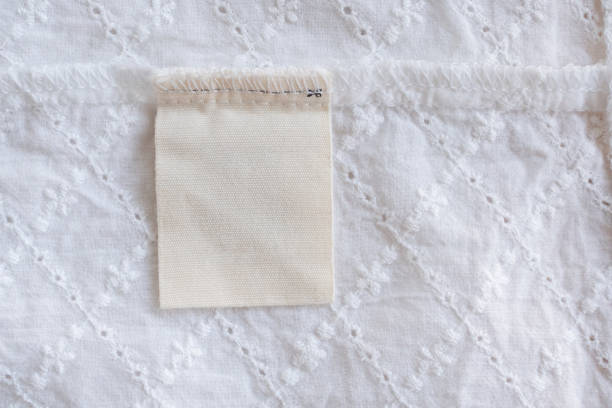istock blank laundry care clothes label on fabric texture background 1147196654