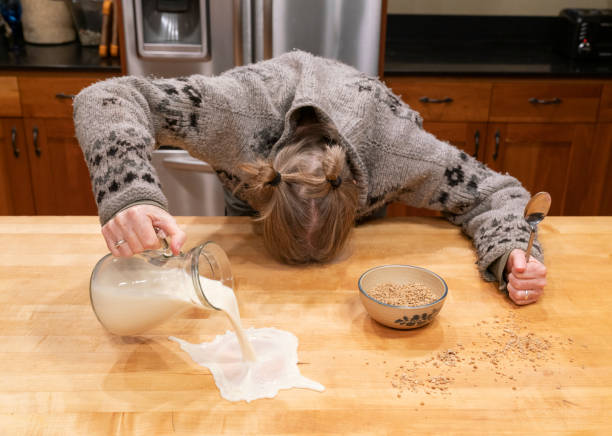 Monday Morning A Woman Having a Rough Day with Breakfast stock photo