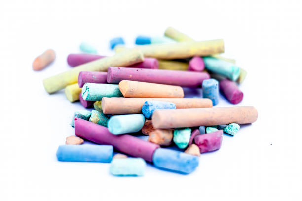 istock Colorful chalk or white colored sticks used to write on black board isolated on white. 1147200152