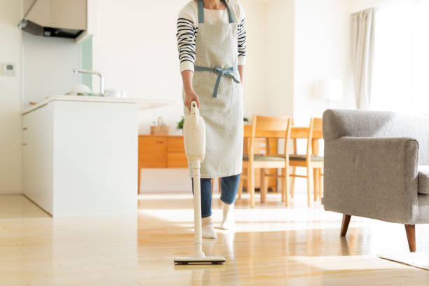 istock Housewife cleaning with vacuum cleaner 1147205841