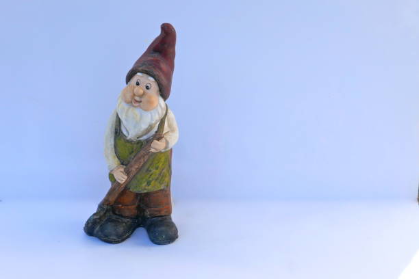 istock Garden gnome with red hat and shovel. Isolated on white background.  (not protected by copyright) 1147210227