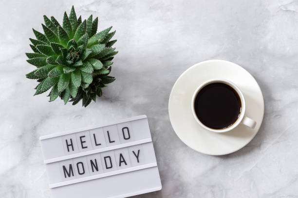 istock Office or home table desk. Lightbox text Hello monday, cup of coffee, succulent on marble background Concept Copy space Flat lay Top view 1147221697
