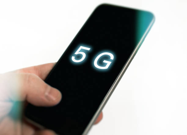 istock 5G technology, Hand using mobile phone with 5g concept, internet on mobile smart phone and on white 1147221787