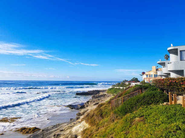 La Jolla, CA, USA: Modern homes on the sunny rocky Pacific Coast against a vibrant blue sky. Plenty of copy space.