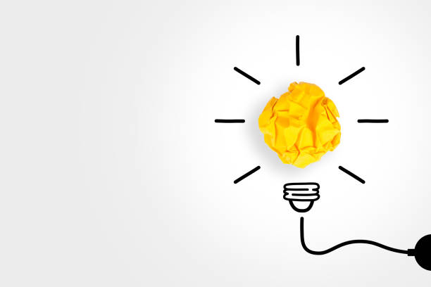 istock Idea Concepts Light Bulb Crumpled Paper on White Background 1147223865