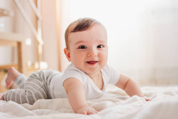istock Charming little baby boy 6 months smiling and looking at the camera 1147223892