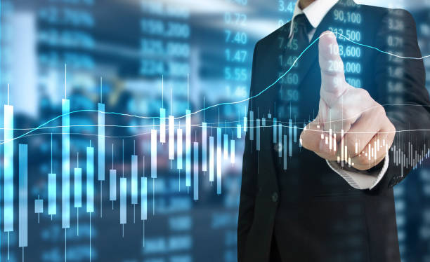 istock hand with stock financial chart symbols coming from hand 1147223955