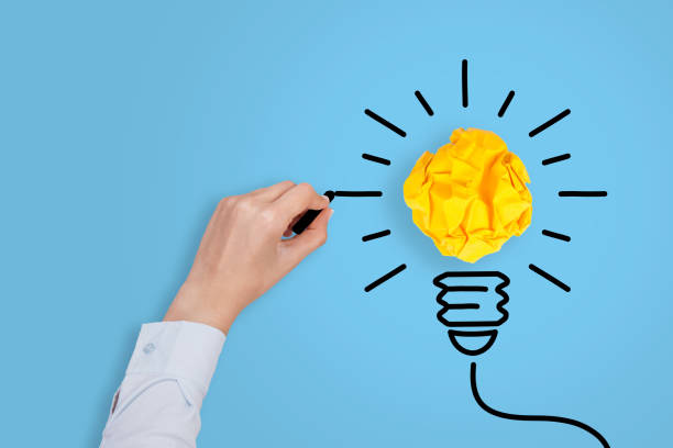 istock Idea Concepts Light Bulb Crumpled Paper on Blue Background 1147223990