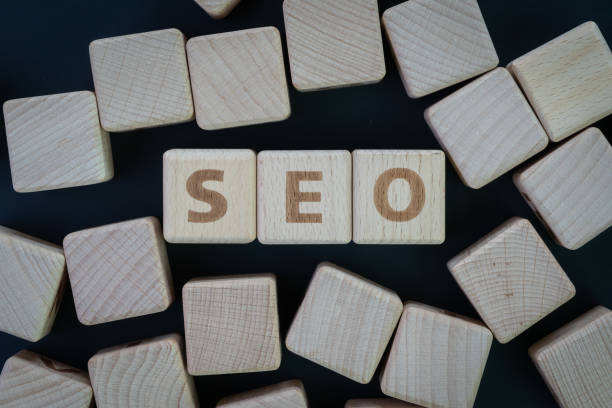 istock SEO, Search Engine Optimization top ranking in search result page concept, wooden cube block with alphabet building the word SEO on blackboard background 1147226479