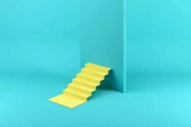 Photo of Yellow stairway blocked by a blue wall isolated on blue background. Minimal conceptual idea concept.