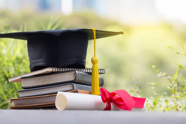 istock The cap and certificated in garden, Graduate education concept 1147227247