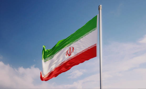 istock Iranian Flag Waving With Wind Over Blue Sky 1147231245