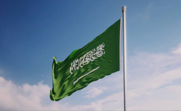 istock Saudi Arabian Flag Waving With Wind Over Blue Sky 1147231271