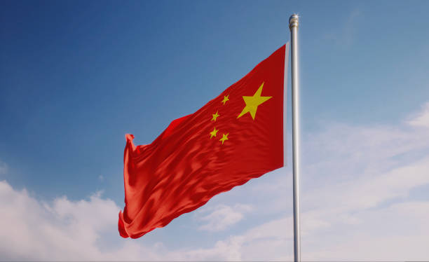 istock Chinese Flag Waving With Wind Over Blue Sky 1147231502