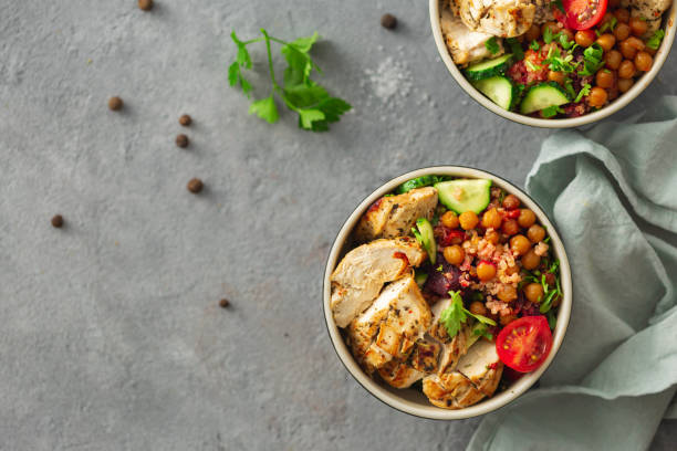istock Healthy eating plate balanced diet two bowl buddha top view on gray concrete background copy space 1147234325
