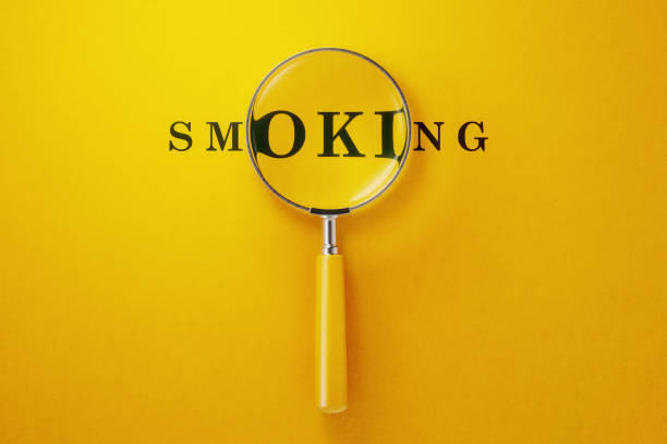 istock Magnifier And Smoking Text On Yellow Background 1147234518