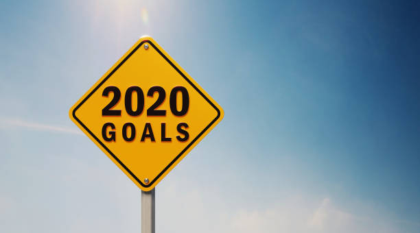 istock Yellow Off Road Traffic Sign With 2020 Goals Text on Blue Sky 1147235197
