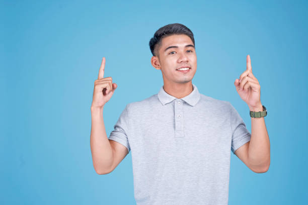 istock Asian young handsome student with new idea, on light blue background 1147236844