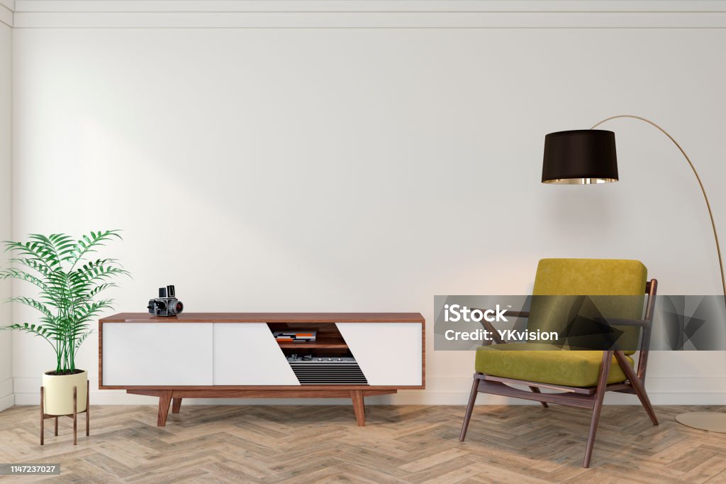 Mid century modern interior empty room with white wall, dresser, console, yellow lounge chair, armchair, floor lamp, wood floor. 3d render illustration mockup. Mid-Century Style Stock Photo