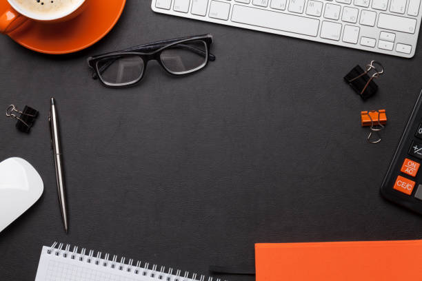 istock Office desk with notepad, coffee cup and supplies 1147246255