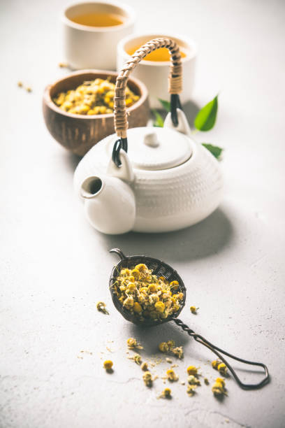 istock chamomile tea in strainer on vintage background 1147247652