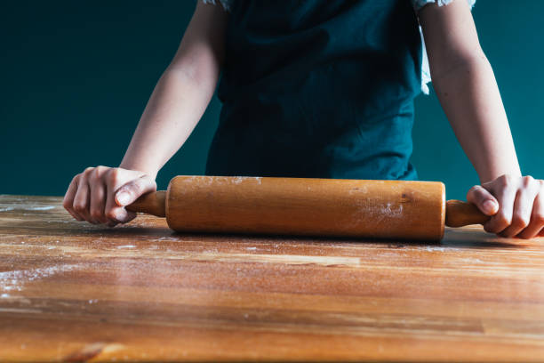 istock little girl making dough 1147250072