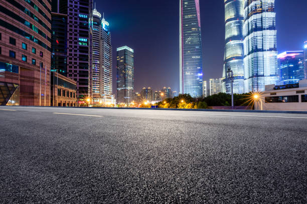 istock Shanghai modern commercial office buildings and empty highway at night 1147250087