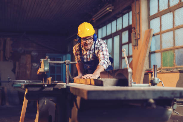 istock Carpenter cutting wooden plank 1147250510