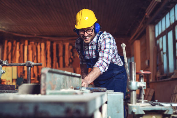 istock Carpenter cutting wooden plank 1147250544
