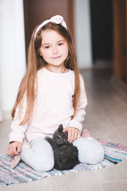 istock Girl with little kitten 1147251559