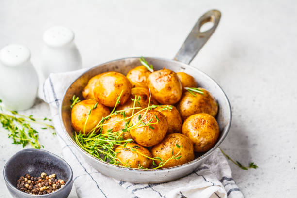 istock Baked potatoes in a cast iron skillet. 1147252495