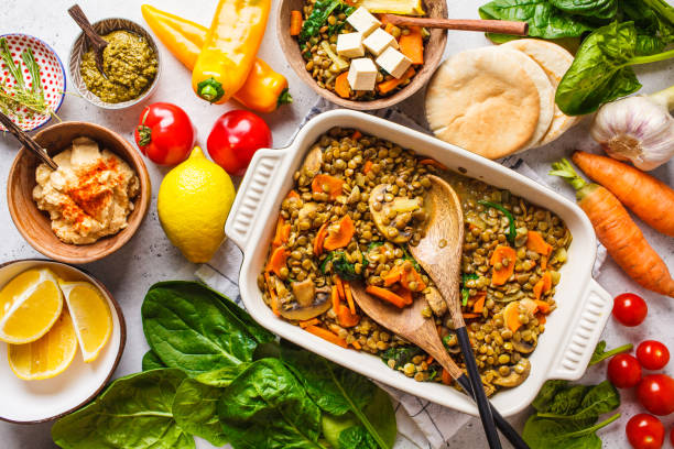 Vegan lentil curry with vegetables, top view. Healthy plant based food background. Vegan lentil curry with vegetables, top view. Healthy vegetarian food background. vegan food stock pictures, royalty-free photos & images