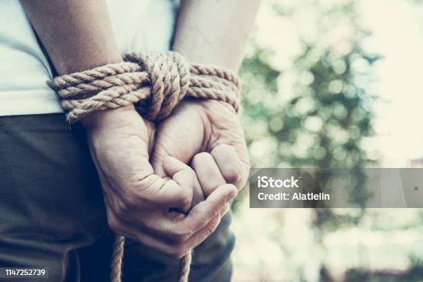 Man With Hands Tied Hands Tied Up With Rope Restraint Concept Stock Photo - Download Image Now