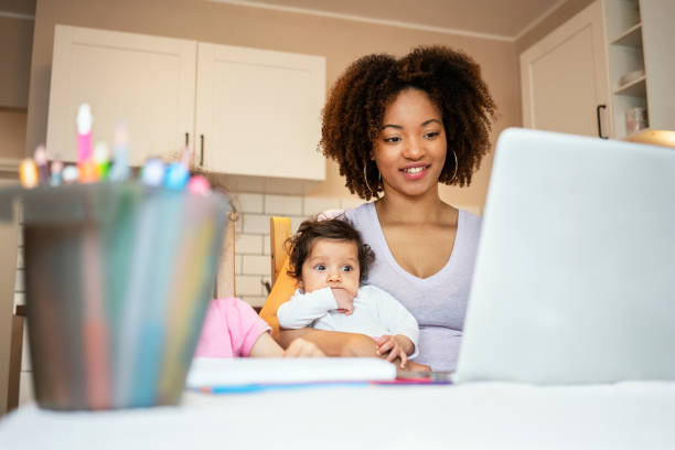 istock Mother and daughter's using laptop at home 1147258878