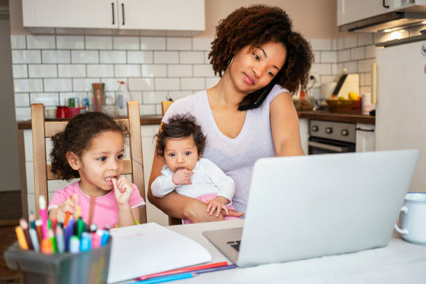 Mother and daughter's using laptop at home Mother and daughter's using laptop at home cuban ethnicity stock pictures, royalty-free photos & images
