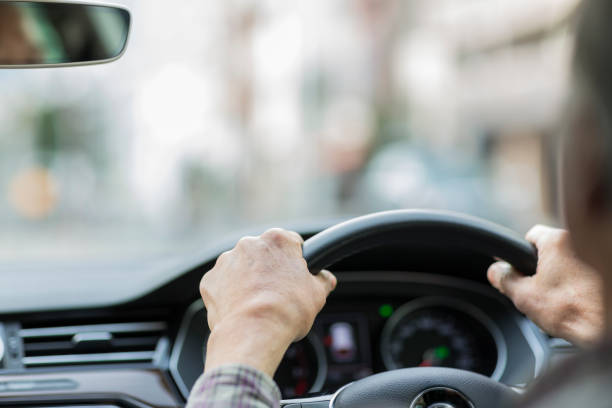 istock Old man driving a car 1147260707