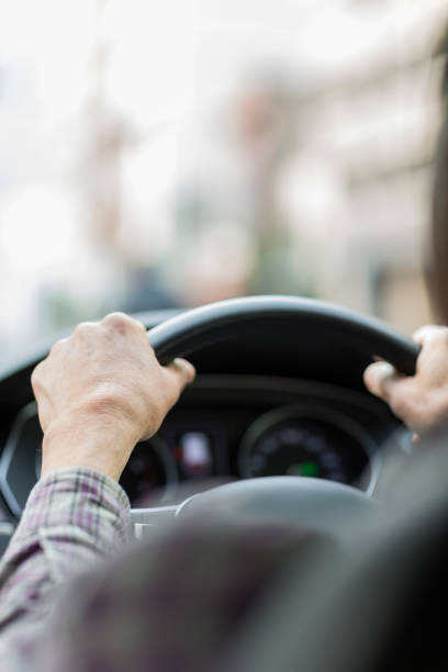 istock Old man driving a car 1147260710