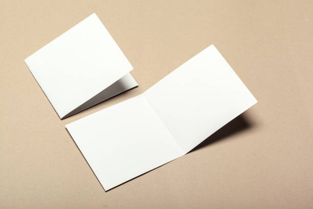 istock Blank paper pieces for mock up on a beige background 1147263928